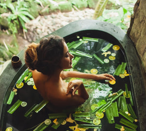 woman enjoying a bath using essential oils